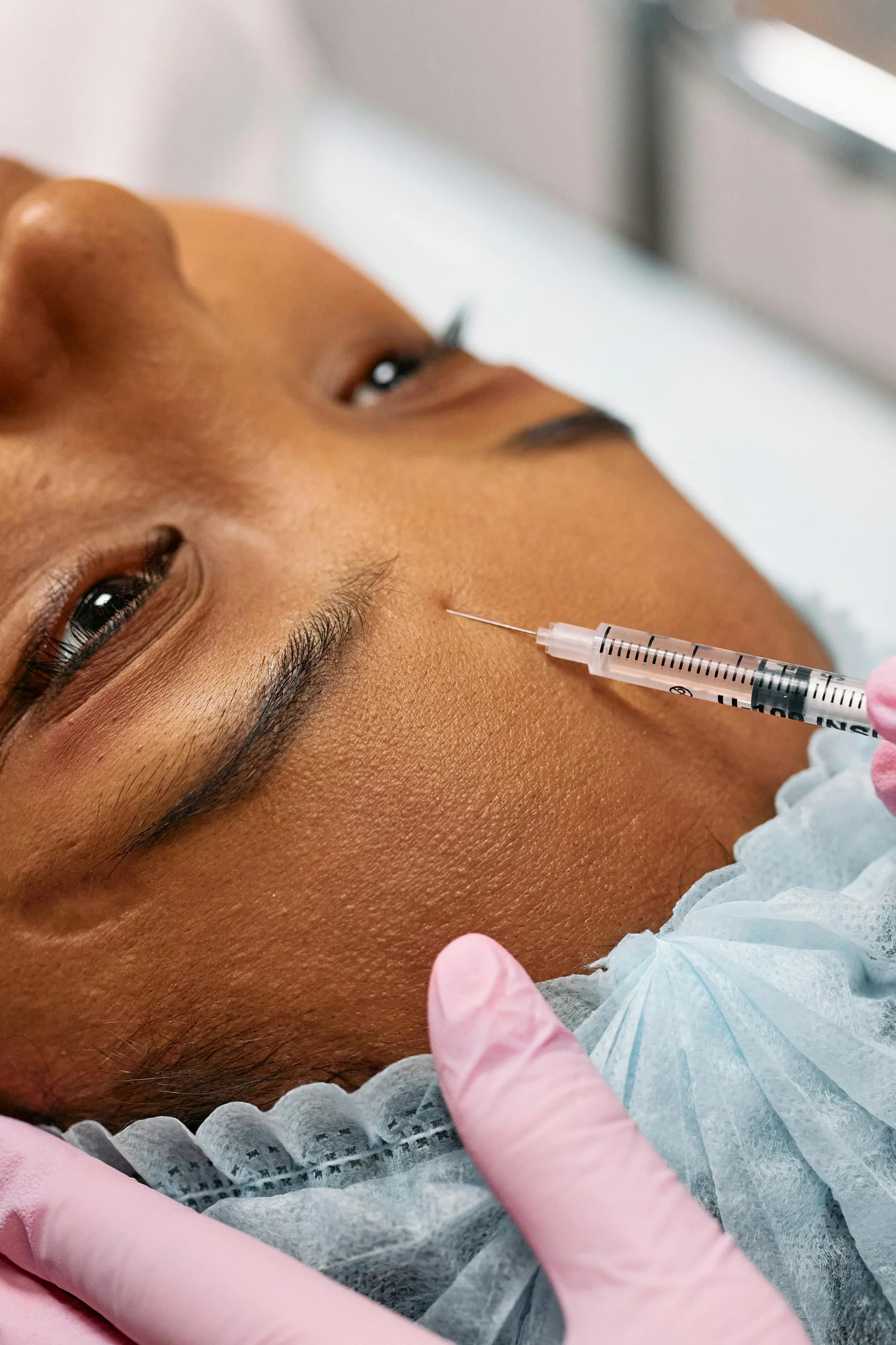 Close up of women getting migraine botox