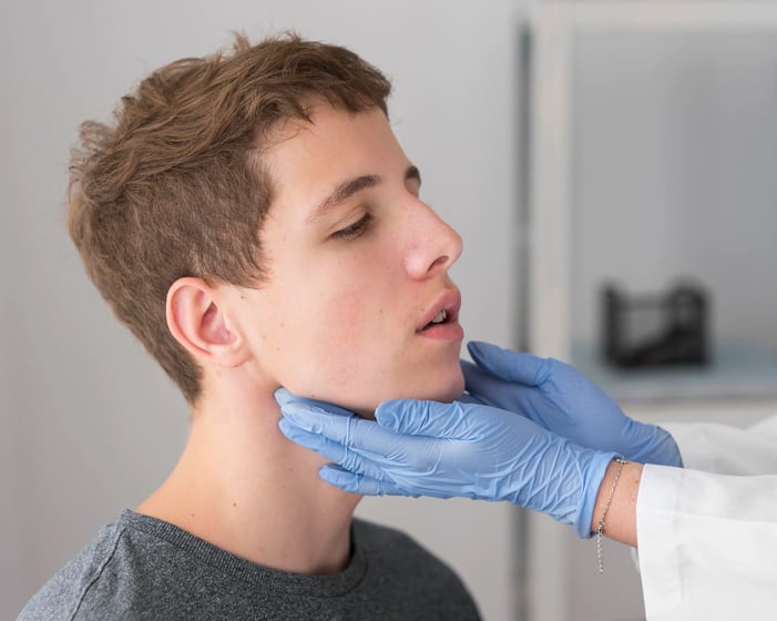 Man getting examined for botox for TMJ