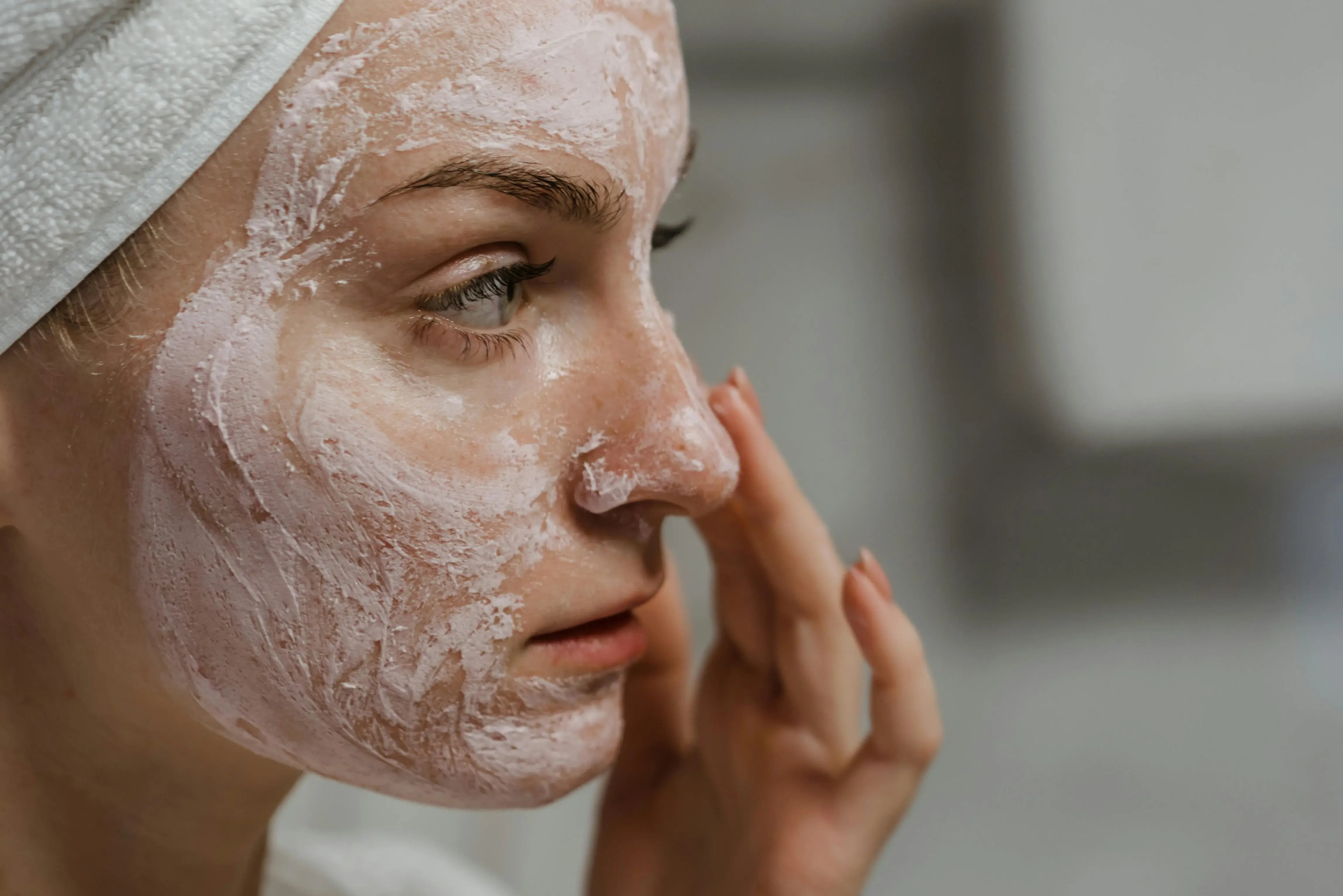 Women applying clay face mask