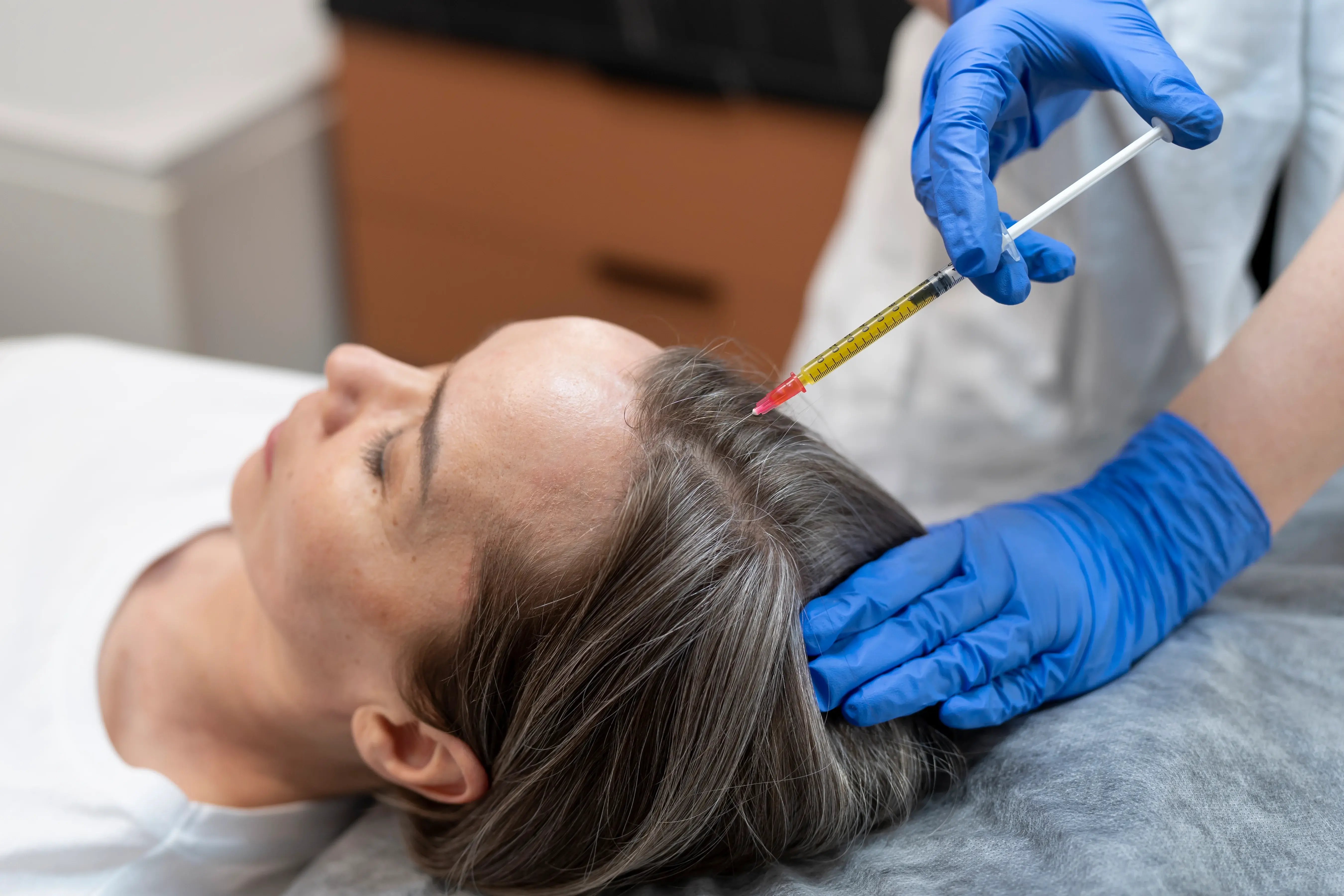 Women getting prp hair treatment for hair loss
