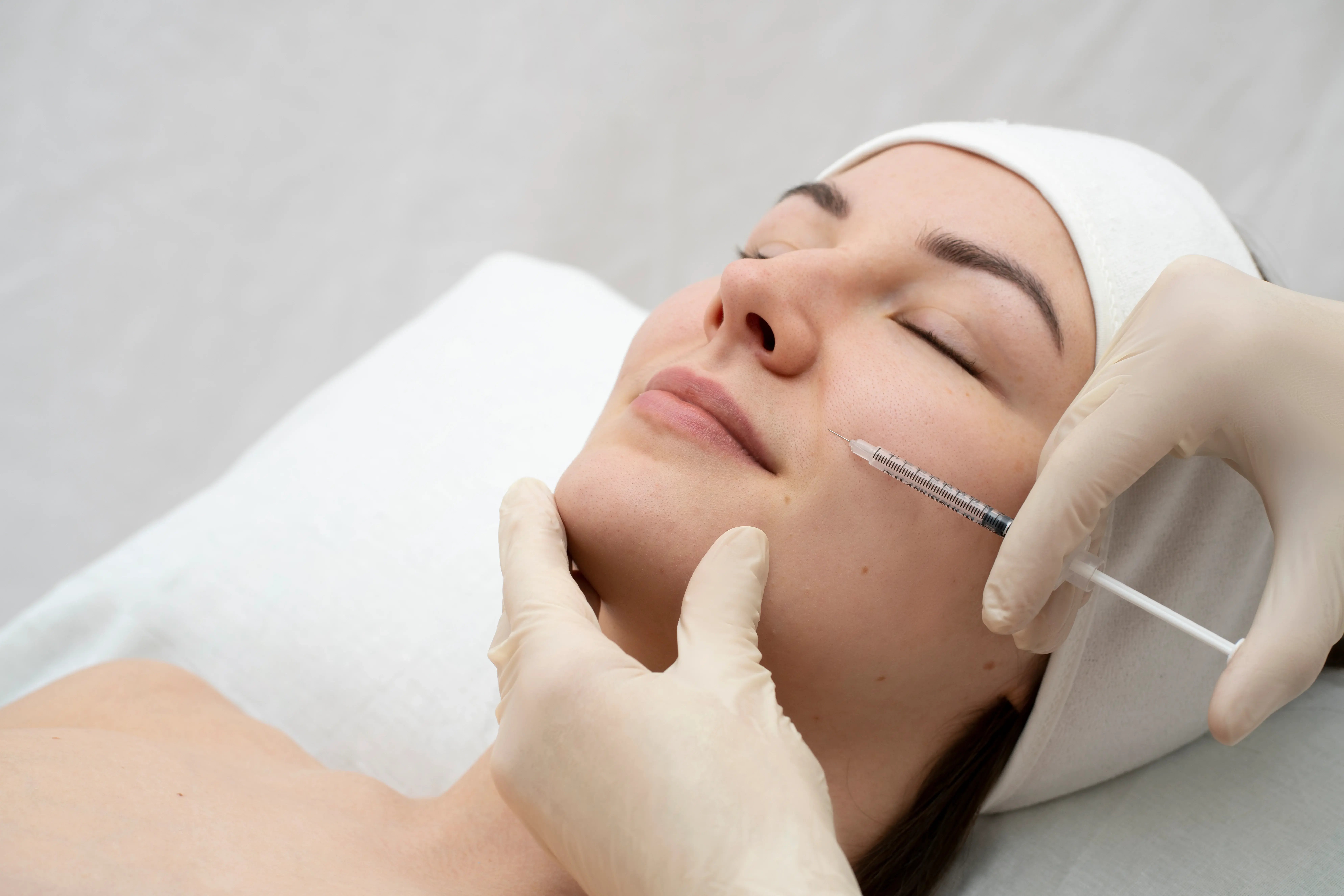 person receiving a sculptra treatment