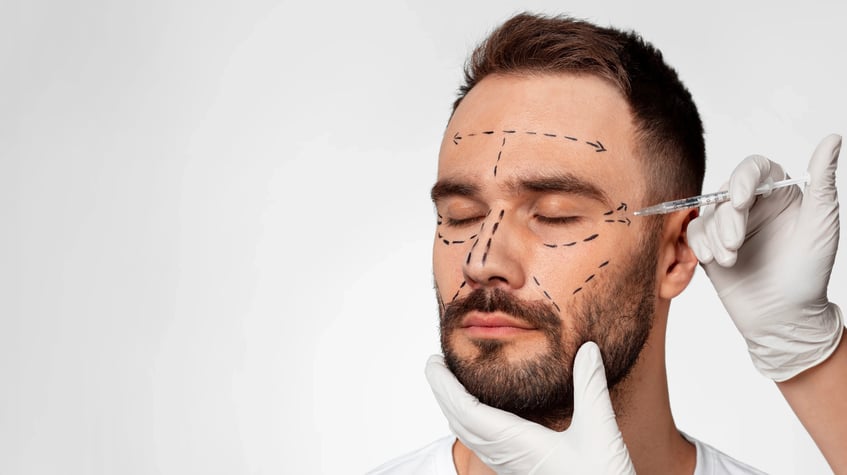 close up of man with doctor marking face anatomy with marker-1