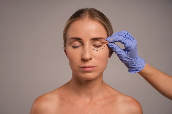 woman preparing under eye treatment
